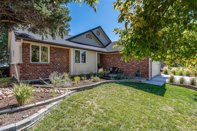 ranch-style house featuring a front yard and a garage