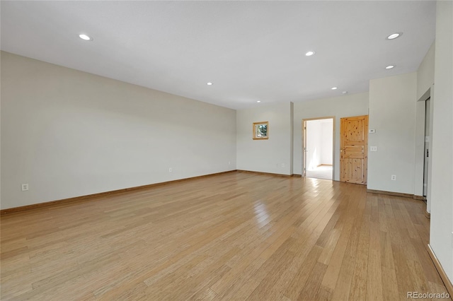 unfurnished room featuring light hardwood / wood-style flooring