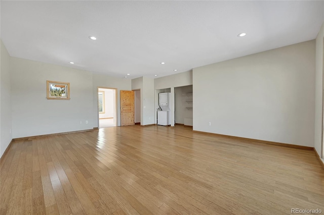 spare room with light hardwood / wood-style flooring