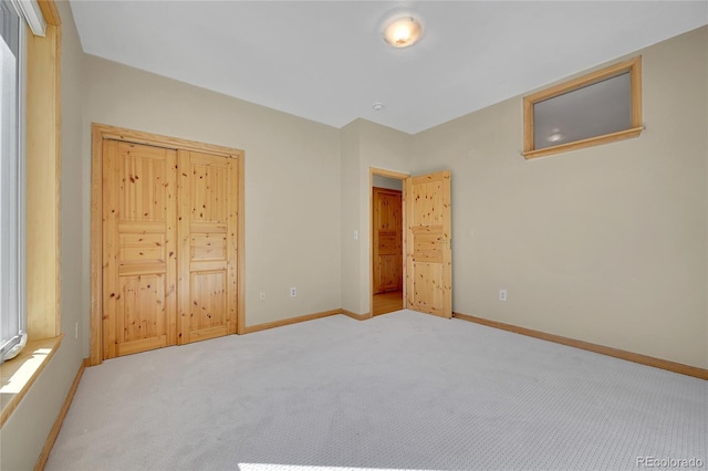 unfurnished bedroom with light carpet