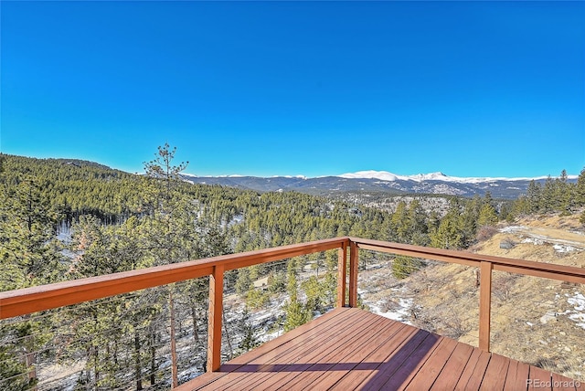 wooden terrace with a mountain view