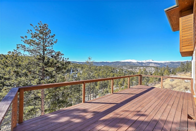 wooden deck featuring a mountain view