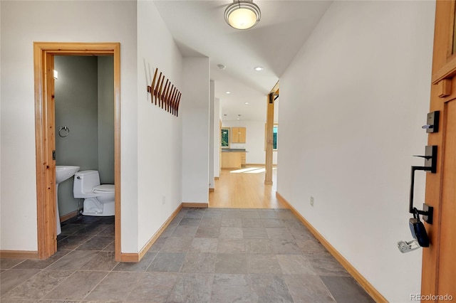54 Doe Trl, Nederland, CO 80466 - hall with baseboards, stone finish floors, and vaulted ceiling