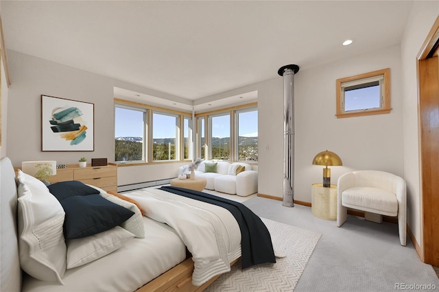 54 Doe Trl, Nederland, CO 80466 - bedroom featuring light colored carpet, a baseboard heating unit, baseboards, a mountain view, and recessed lighting