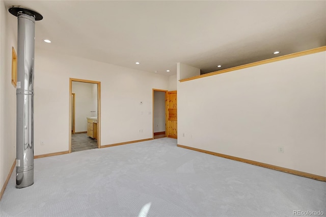 54 Doe Trl, Nederland, CO 80466 - unfurnished bedroom featuring light colored carpet, recessed lighting, baseboards, and connected bathroom