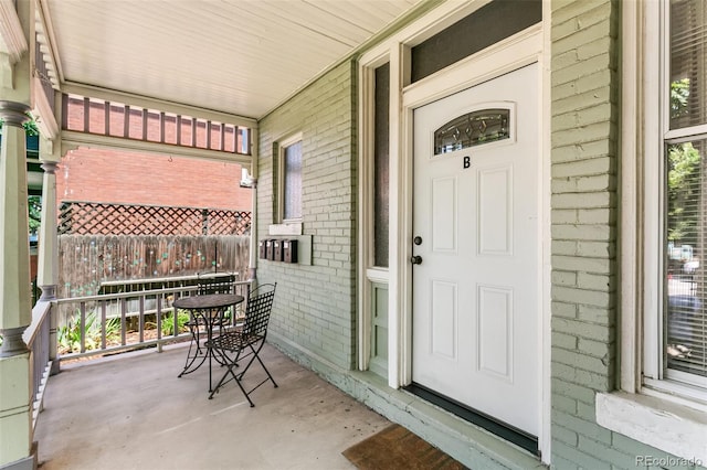 property entrance featuring covered porch