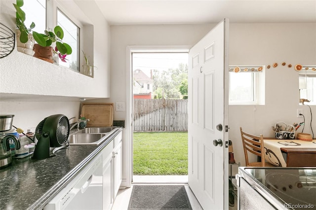 doorway to outside featuring sink