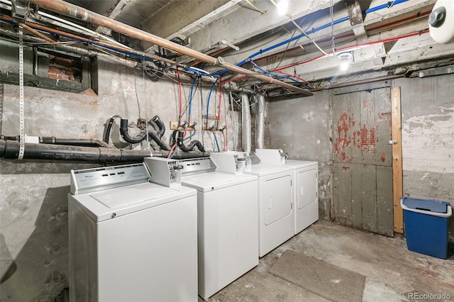 laundry area with washing machine and clothes dryer