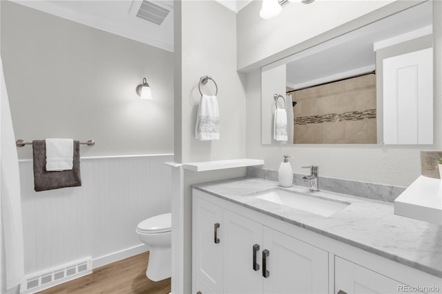 7055 S Costilla St, Littleton, CO 80120 - full bathroom featuring vanity, a wainscoted wall, wood finished floors, and tiled shower
