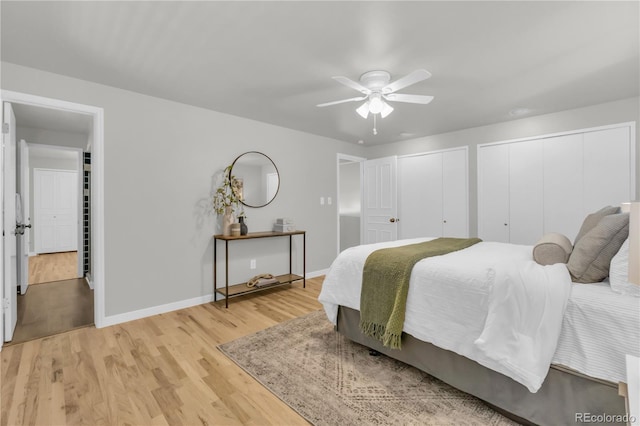 7055 S Costilla St, Littleton, CO 80120 - bedroom with two closets, light wood-type flooring, and ceiling fan