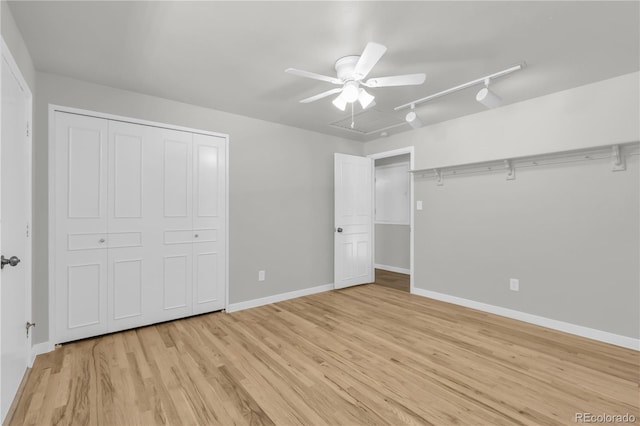 7055 S Costilla St, Littleton, CO 80120 - unfurnished bedroom featuring light wood-style flooring, a closet, track lighting, and a ceiling fan