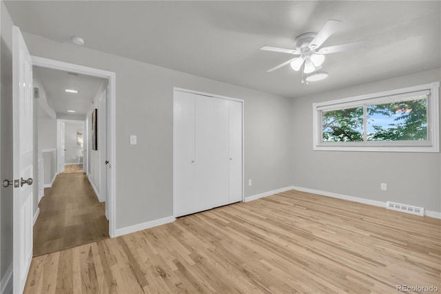 7055 S Costilla St, Littleton, CO 80120 - unfurnished bedroom with light wood-style floors, a closet, and a ceiling fan