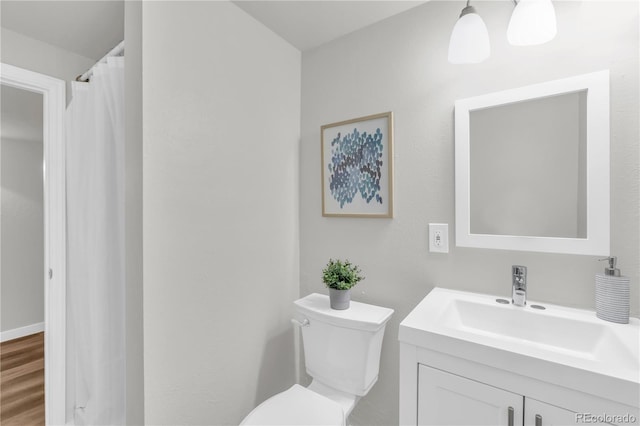 7055 S Costilla St, Littleton, CO 80120 - bathroom with vanity and wood finished floors