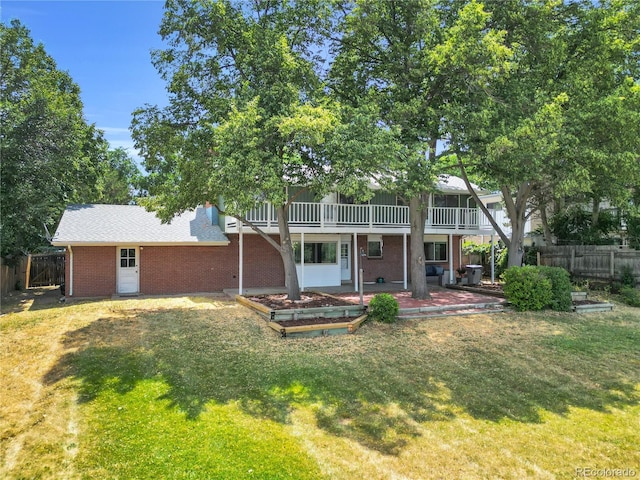 7055 S Costilla St, Littleton, CO 80120 - view of front facade with brick siding, a patio, and a wooden deck
