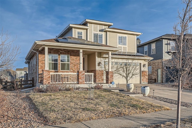 view of front of home with a porch and a garage