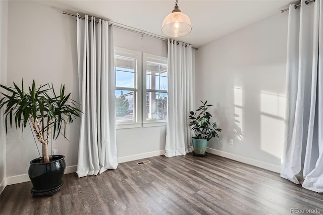 empty room featuring hardwood / wood-style floors