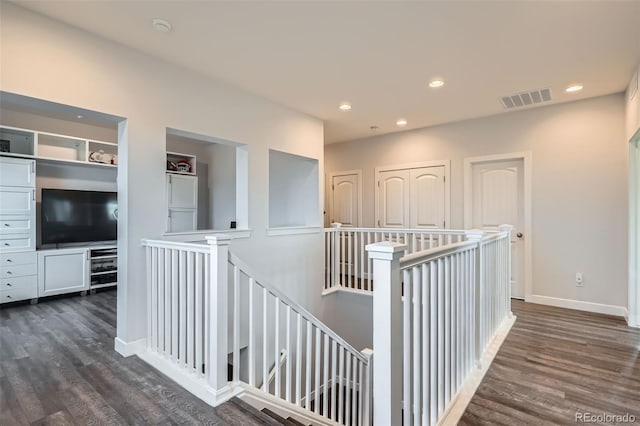 hallway with dark wood-type flooring