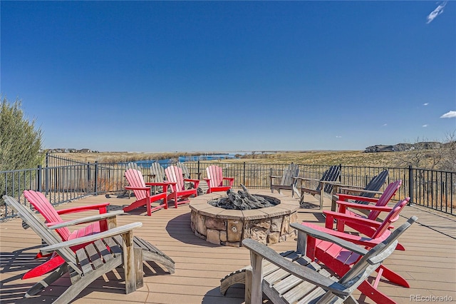 wooden terrace featuring a fire pit