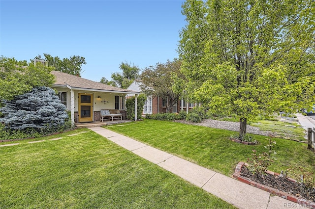 1292 Kearney St, Denver, CO 80220 - view of front of home with a porch and a front lawn