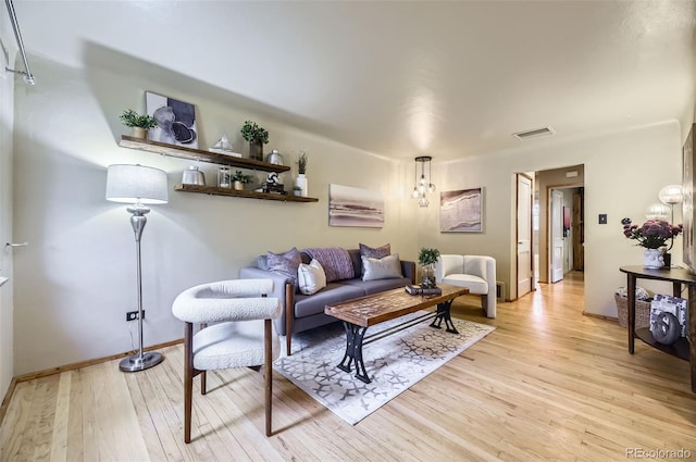 1292 Kearney St, Denver, CO 80220 - living room featuring light wood-type flooring and baseboards