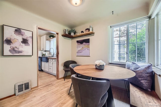 1292 Kearney St, Denver, CO 80220 - dining area featuring light wood-type flooring, healthy amount of natural light, and baseboards
