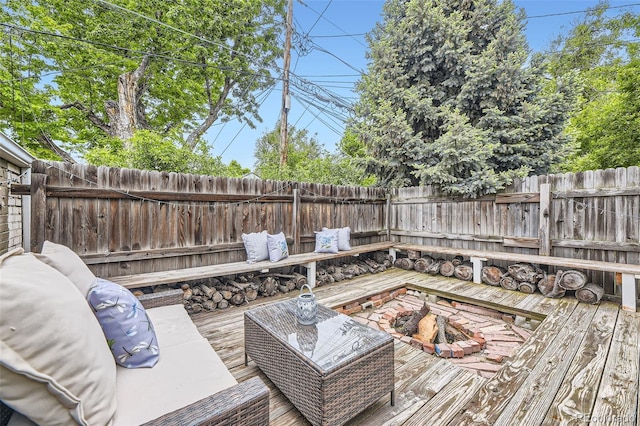 1292 Kearney St, Denver, CO 80220 - wooden deck with a fenced backyard and an outdoor living space with a fire pit