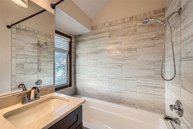 full bathroom featuring shower / bath combination, lofted ceiling, and vanity