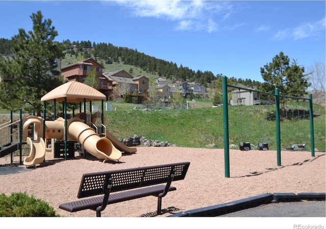 communal playground with a mountain view