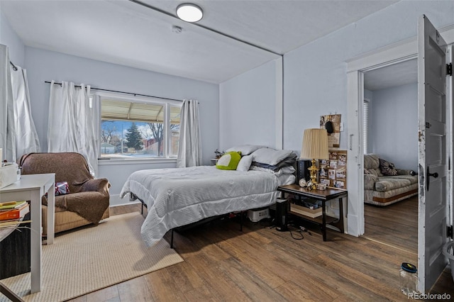 bedroom with wood finished floors