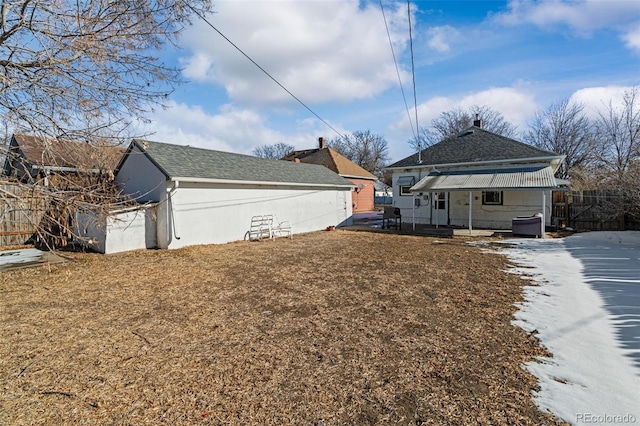 exterior space with an outbuilding and fence