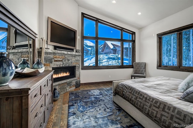 141 Sawmill Run Dr, Breckenridge, CO 80424 - bedroom featuring dark wood finished floors, a fireplace, and recessed lighting