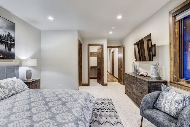 141 Sawmill Run Dr, Breckenridge, CO 80424 - bedroom featuring a walk in closet, recessed lighting, and light carpet