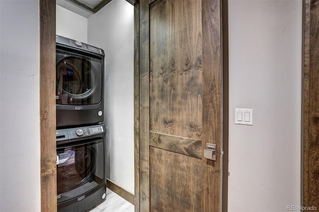 141 Sawmill Run Dr, Breckenridge, CO 80424 - washroom featuring estacked washer and dryer and wood finished floors