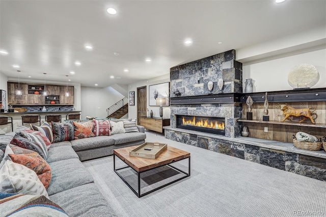 141 Sawmill Run Dr, Breckenridge, CO 80424 - living room featuring stairway, recessed lighting, and a stone fireplace