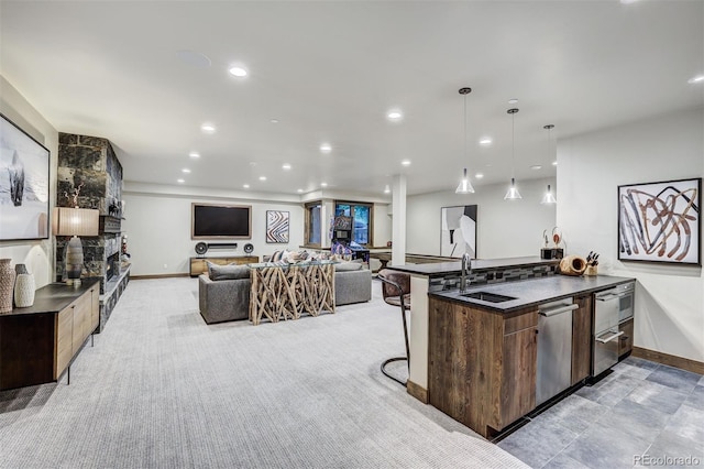 141 Sawmill Run Dr, Breckenridge, CO 80424 - kitchen featuring dark countertops, modern cabinets, open floor plan, a breakfast bar, and recessed lighting