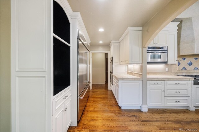 850 E Radcliff Ave, Cherry Hills Village, CO 80113 - kitchen featuring white cabinetry, recessed lighting, light countertops, tasteful backsplash, and double oven
