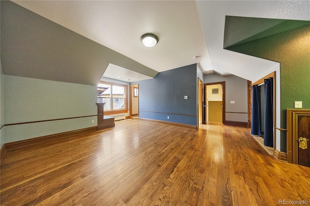 850 E Radcliff Ave, Cherry Hills Village, CO 80113 - additional living space featuring lofted ceiling and wood finished floors