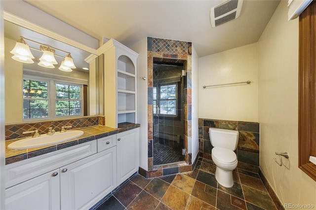 850 E Radcliff Ave, Cherry Hills Village, CO 80113 - bathroom with vanity, tile walls, plenty of natural light, a shower stall, and stone tile floors