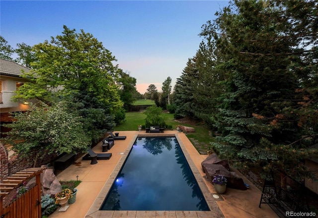 850 E Radcliff Ave, Cherry Hills Village, CO 80113 - pool at dusk with an outdoor pool and a patio area