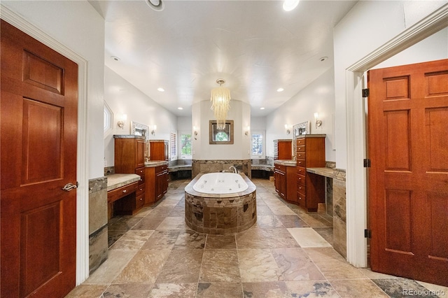 850 E Radcliff Ave, Cherry Hills Village, CO 80113 - bathroom featuring two vanities, a jetted tub, recessed lighting, and stone finish floors