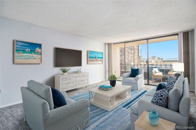 carpeted living room featuring a textured ceiling and expansive windows