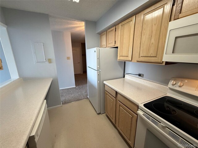 kitchen with white appliances, baseboards, light countertops, a textured ceiling, and light brown cabinets