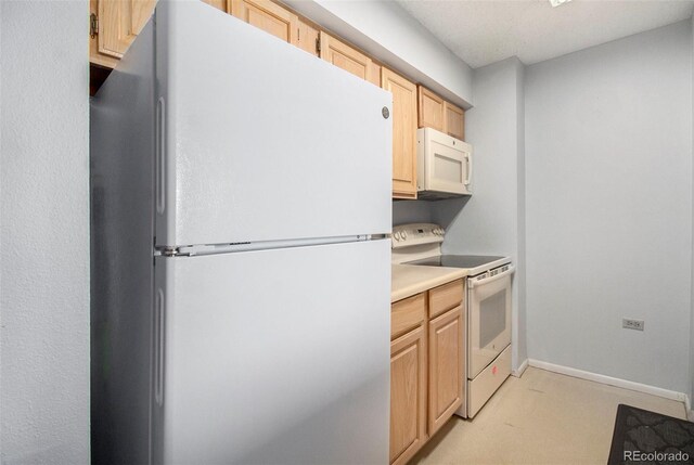 kitchen featuring white appliances, light brown cabinets, baseboards, and light countertops