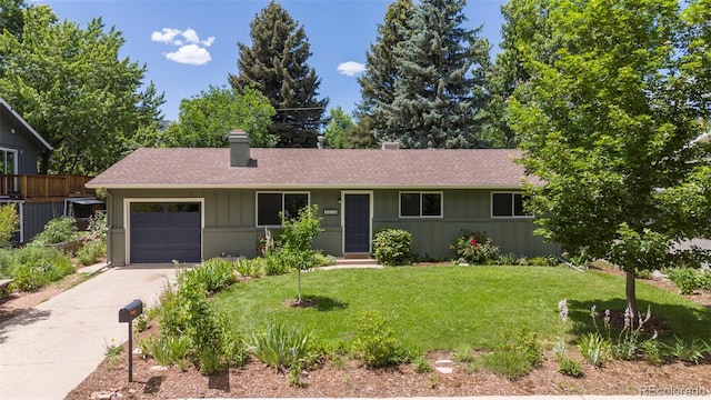 3545 Cloverleaf Dr, Boulder, CO 80304 - ranch-style home with an attached garage, concrete driveway, a shingled roof, and board and batten siding