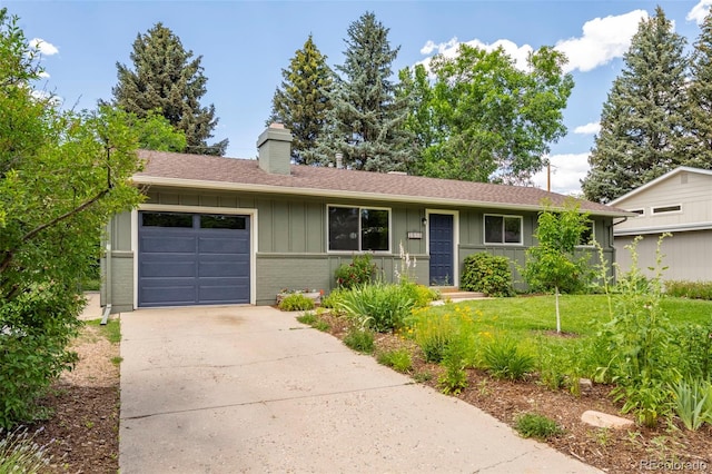 3545 Cloverleaf Dr, Boulder, CO 80304 - ranch-style house with a chimney, board and batten siding, a garage, concrete driveway, and brick siding