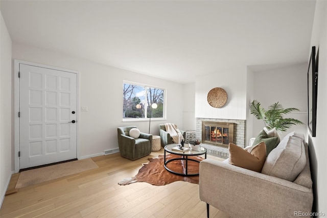 3545 Cloverleaf Dr, Boulder, CO 80304 - living area with wood finished floors and a brick fireplace
