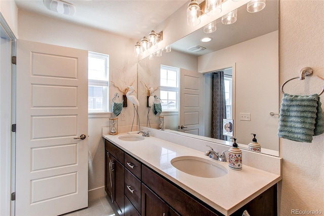 8361 Parkland St, Broomfield, CO 80021 - bathroom featuring double vanity, a sink, and visible vents