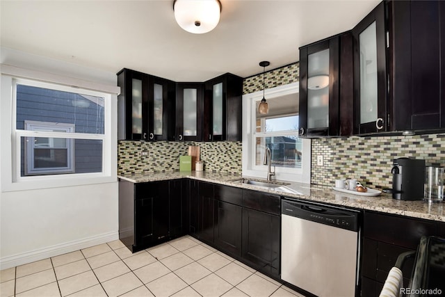 kitchen with sink, backsplash, dishwasher, and hanging light fixtures