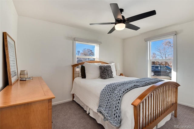 bedroom featuring ceiling fan and carpet