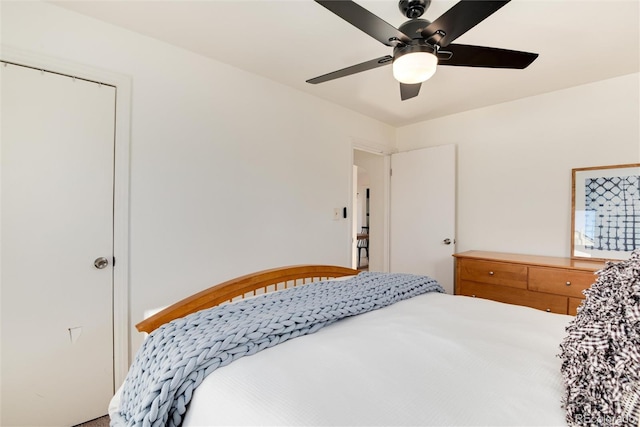 bedroom featuring ceiling fan and a closet